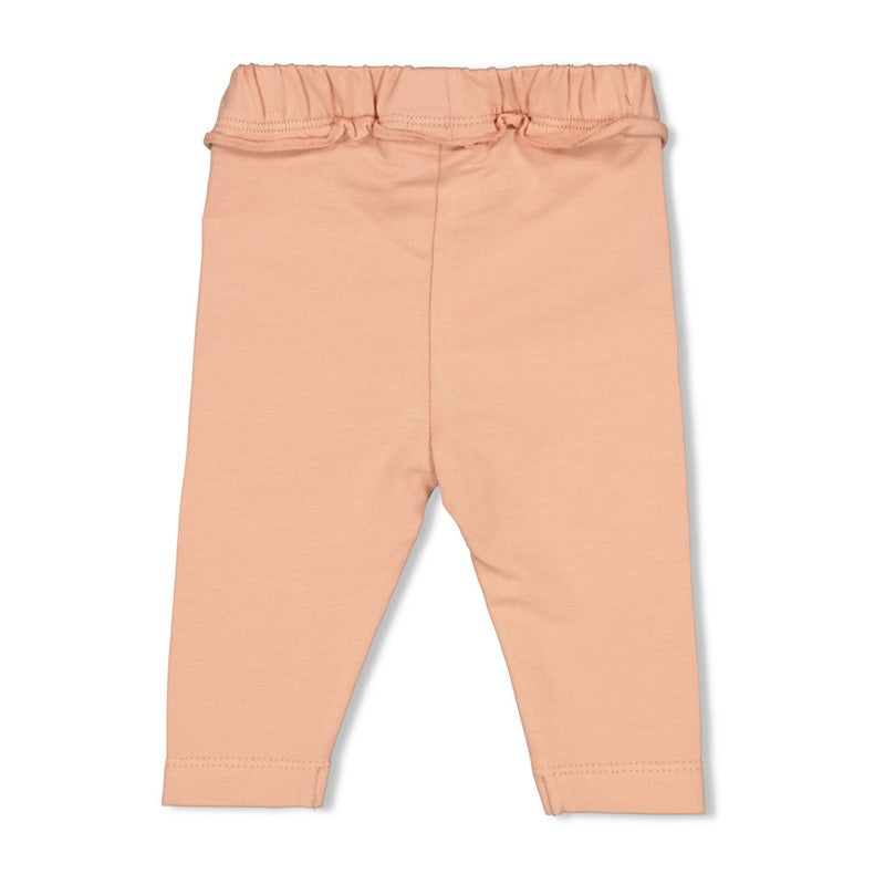 peach farbene stoffhose von feetje mit rüschenbund für babys aus baumwolle - rückansicht